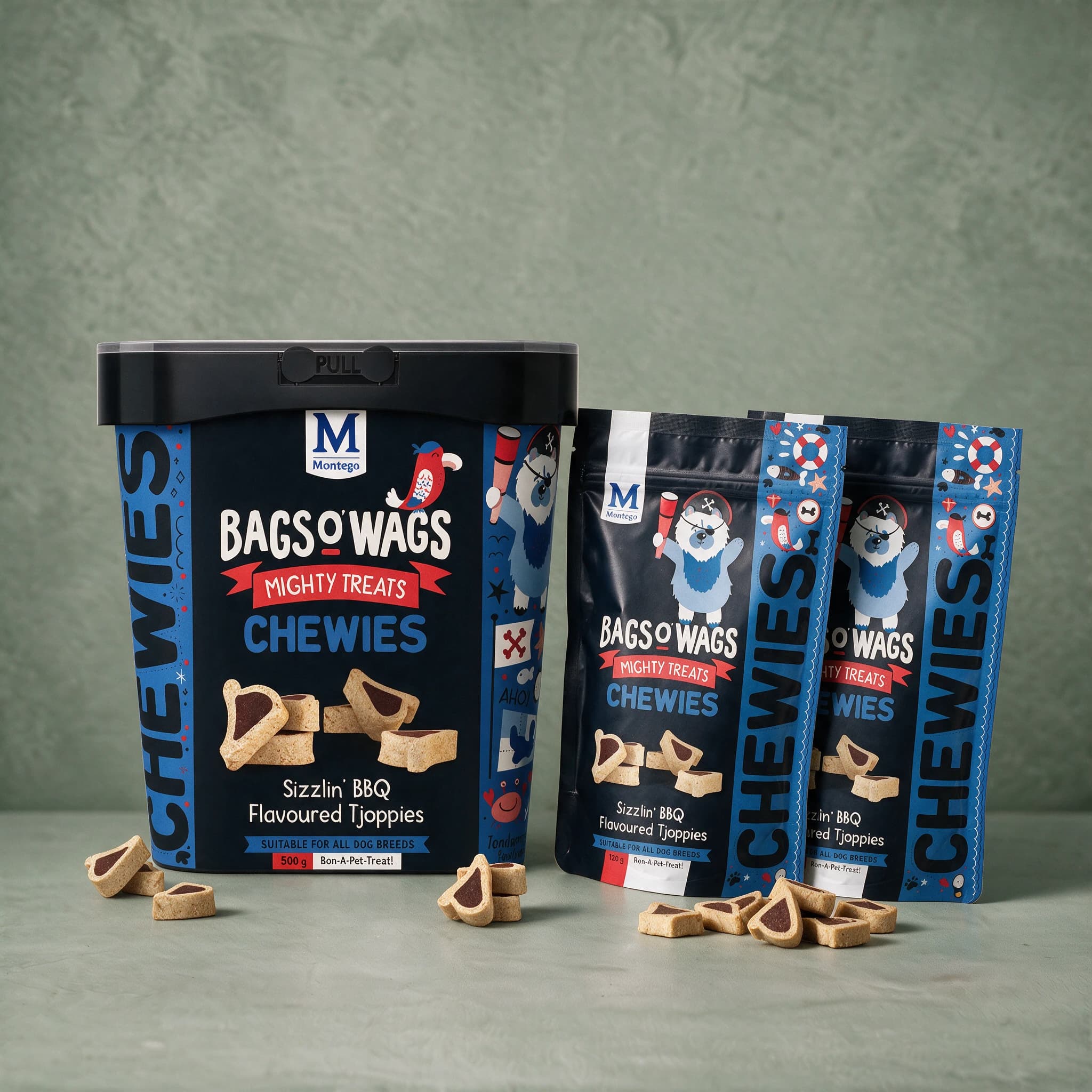 A black plastic 500 g tub of Bags O' Wags Mighty Treats Chewies BBQ Tjoppies standing beside two black 120 g pouches of the same flavour, all three packs against a plain sage green studio background.