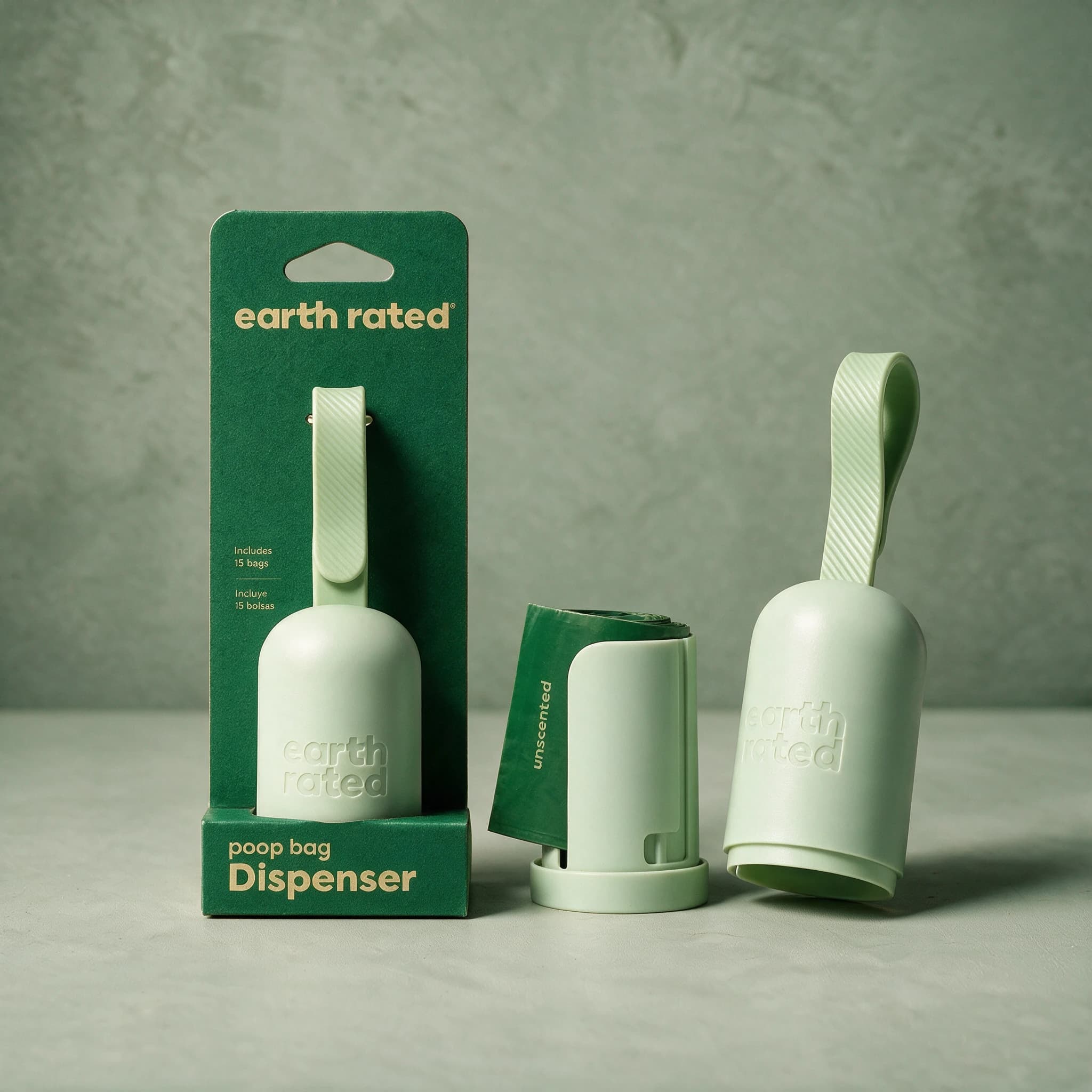 Earth Rated leash-clip poop bag dispenser shown in two states — still in its retail packaging, fully assembled and clipped shut, and mid-loading with a roll of bags, and the top clipped off.