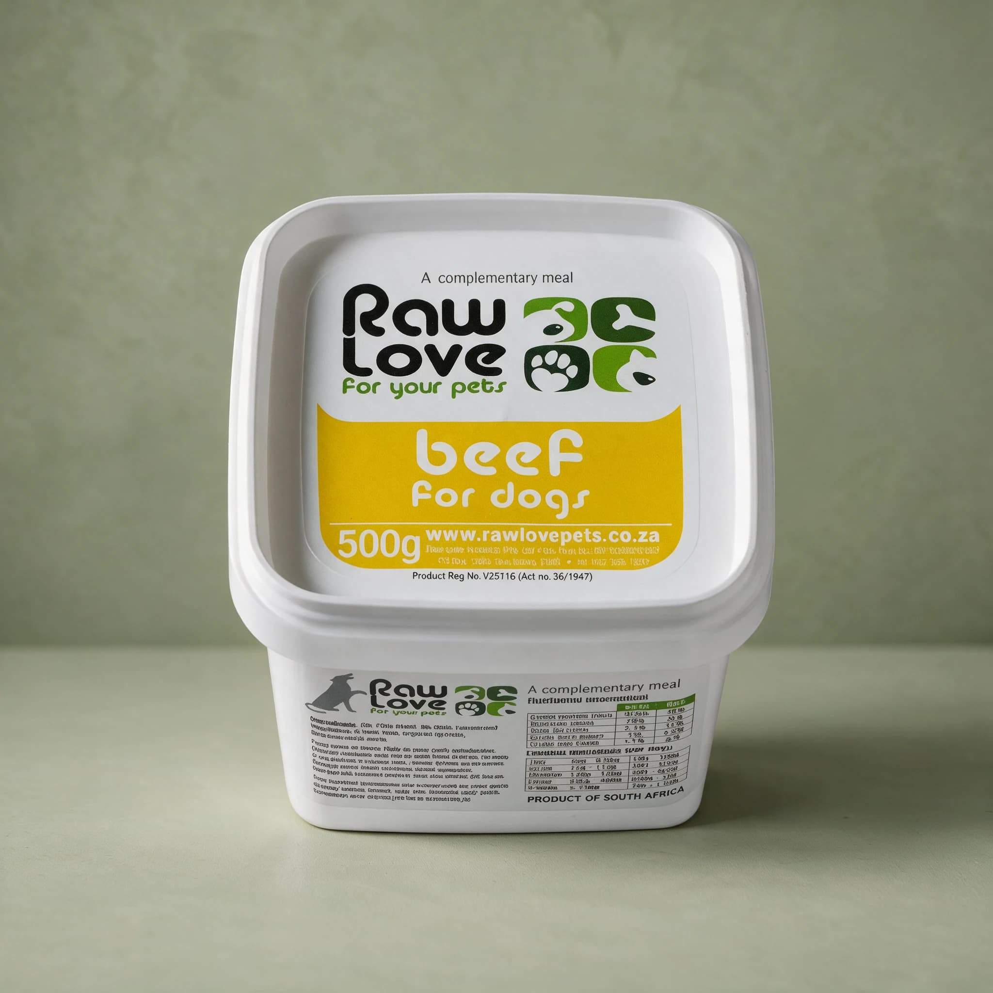 White 500g tub of Raw Love Beef for Dogs raw frozen food, yellow label panel with the Raw Love logo and the words 'A complementary meal', photographed against a sage green background.