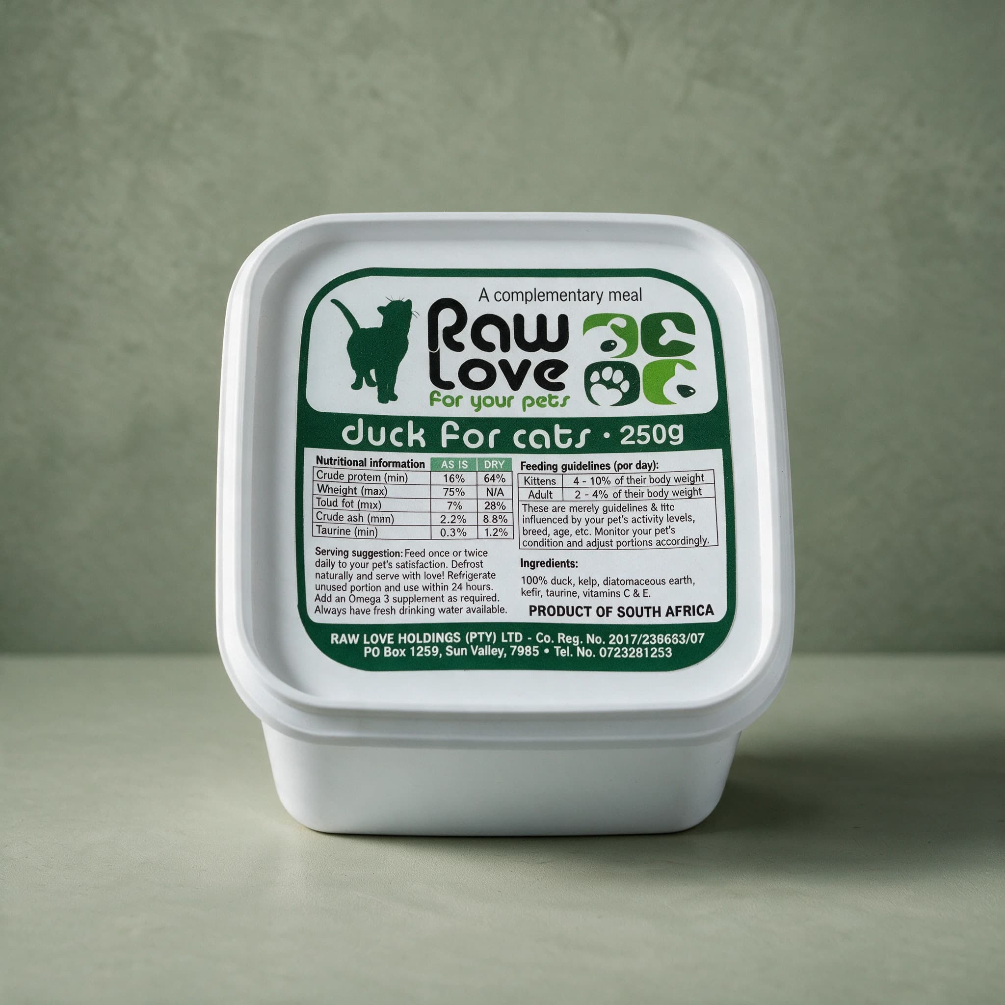 White 250g tub of Raw Love Duck for Cats raw frozen food, dark green label with a cat silhouette, the Raw Love logo, a nutritional information table and feeding guidelines, photographed against a sage green background.