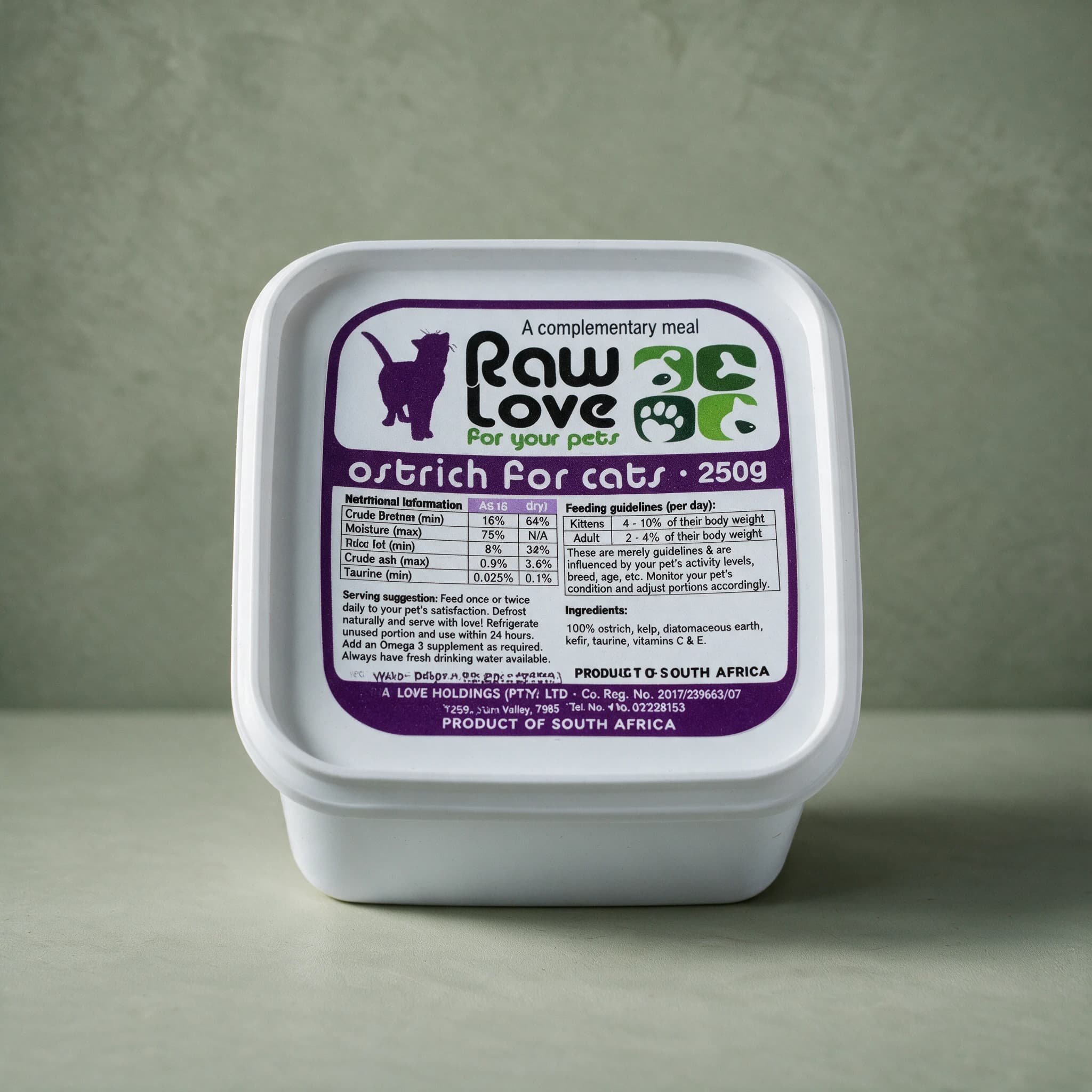 White 250g tub of Raw Love Ostrich for Cats raw frozen food, purple label with a cat silhouette, the Raw Love logo, a nutritional information table and feeding guidelines, photographed against a sage green background.
