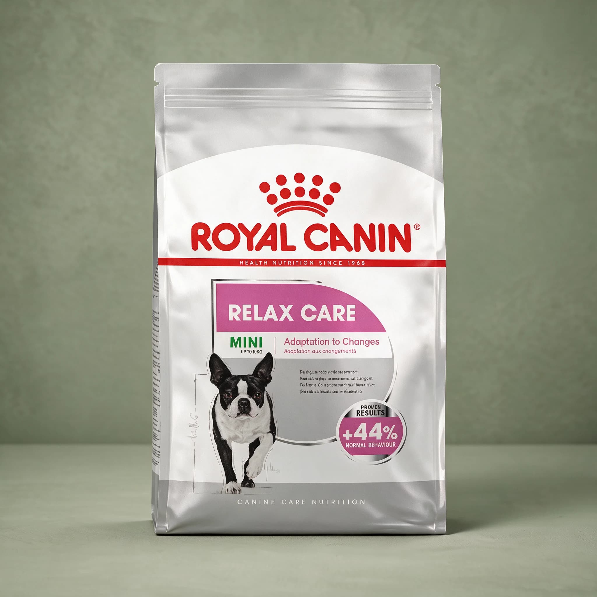 A silver and pink Royal Canin bag labeled "Relax Care Mini" with an "Adaptation to Changes" callout and a "+44% Normal Behaviour" proven-results badge, standing upright against a sage green studio background.