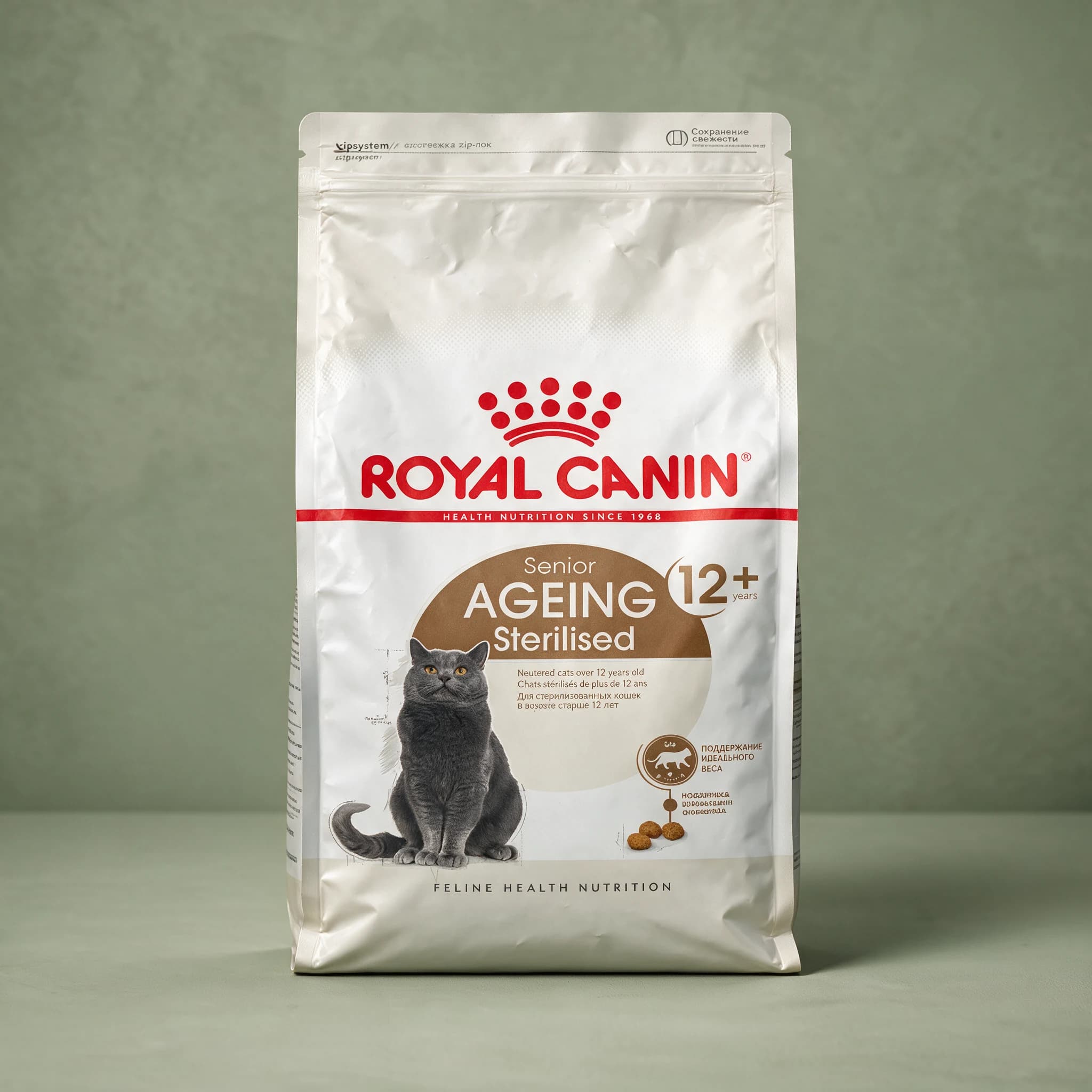 The grey Royal Canin Sterilised Senior Ageing 12+ dry cat food bag, featuring a senior cat illustration and "Sterilised" life-stage branding, photographed against a plain sage green studio background.