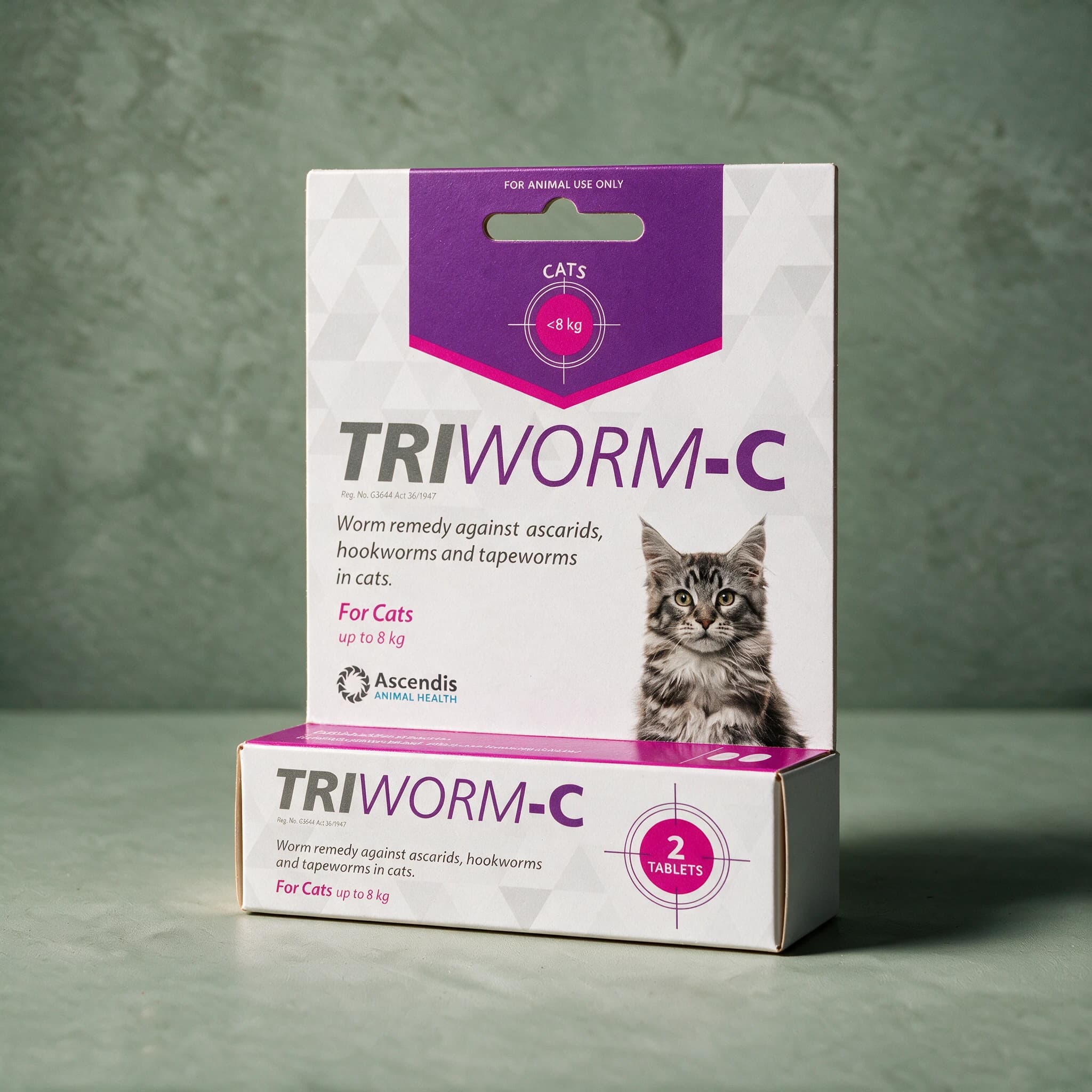 Purple, pink and white Triworm-C Dewormer for Cats box (2 tablets), with a cat photo on the front panel.